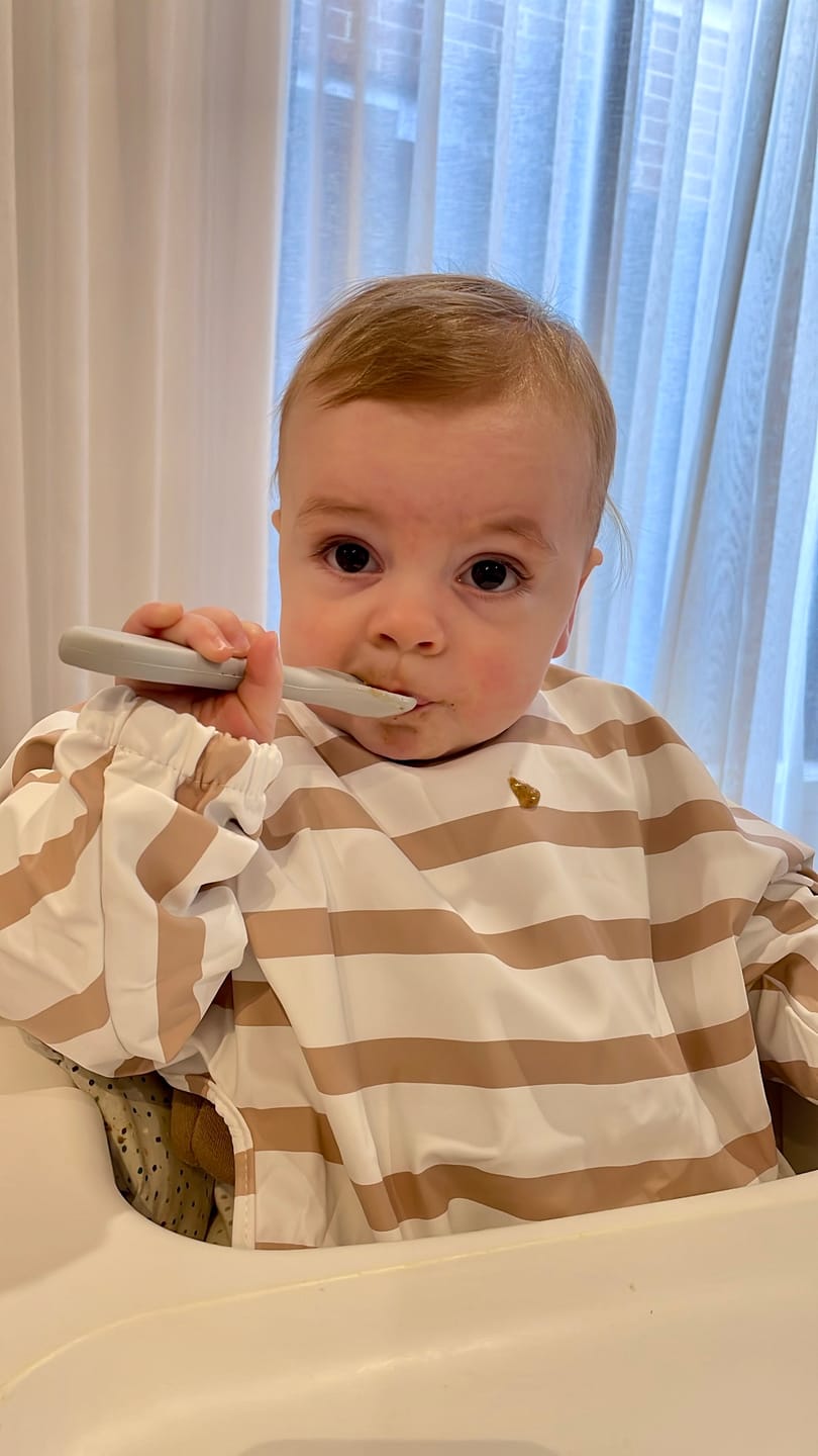 Customer photo review of Mess-Free Smock Bib | Brown Stripe