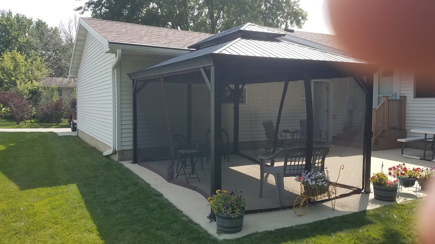 Customer photo review of Shade N' Shelters 10' x 14' Granite Peak Hardtop Gazebo Privacy Curtain with Hooks