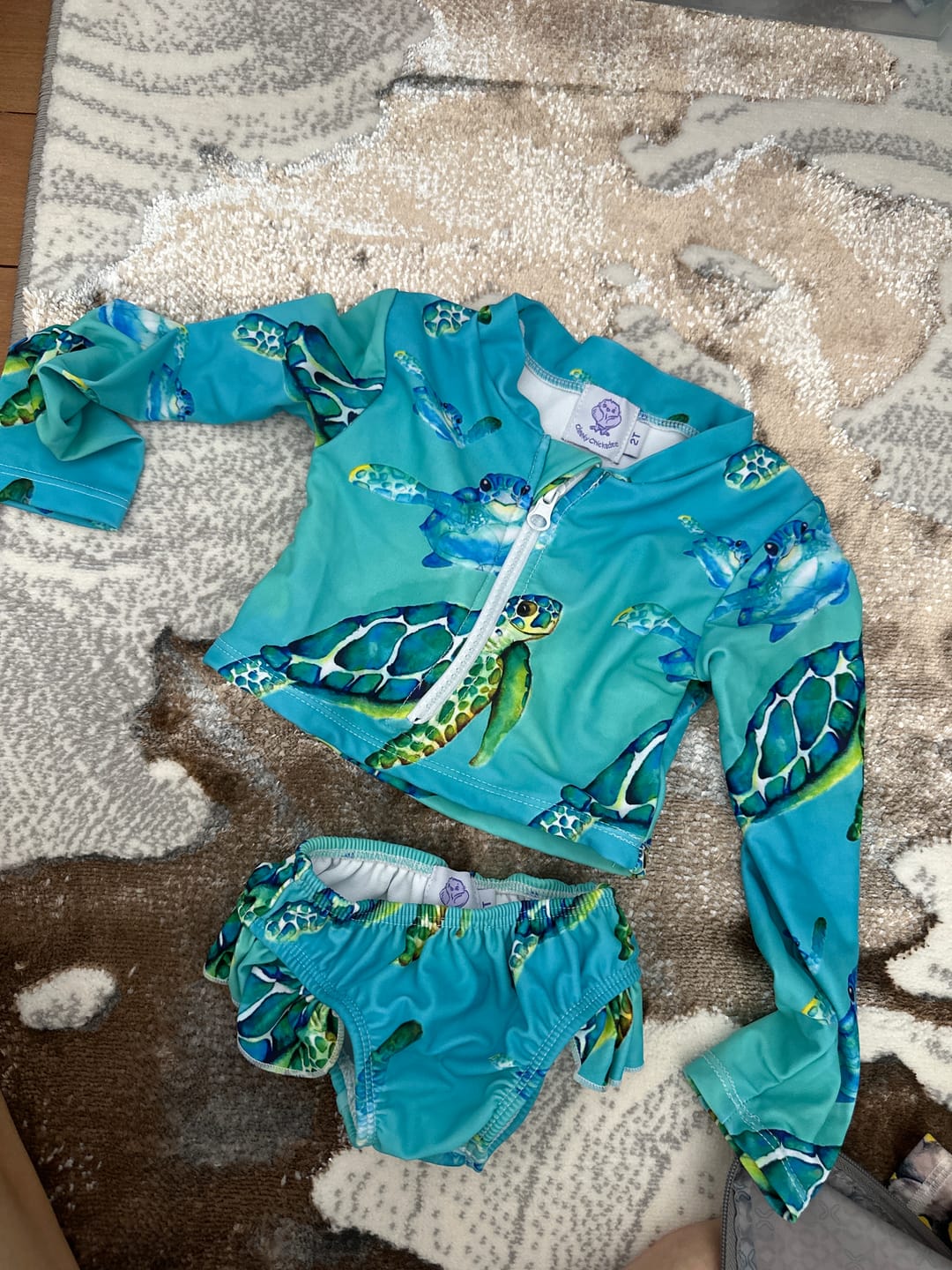 Customer photo review of Blue Turtle Girls Long Sleeve Two Piece Zip Swimmers
