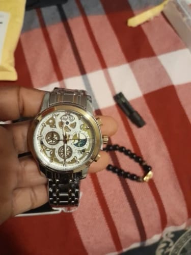 Customer photo review of Elegane® 9947 Men's Watches Top Brand Luxury Original Waterproof Quartz Watch for Man Gold Skeleton Style 24 Hour Day Night