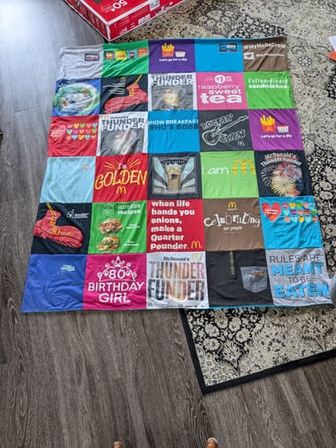 T-shirt quilt with fast food, celebration themes by Cheryl from IN