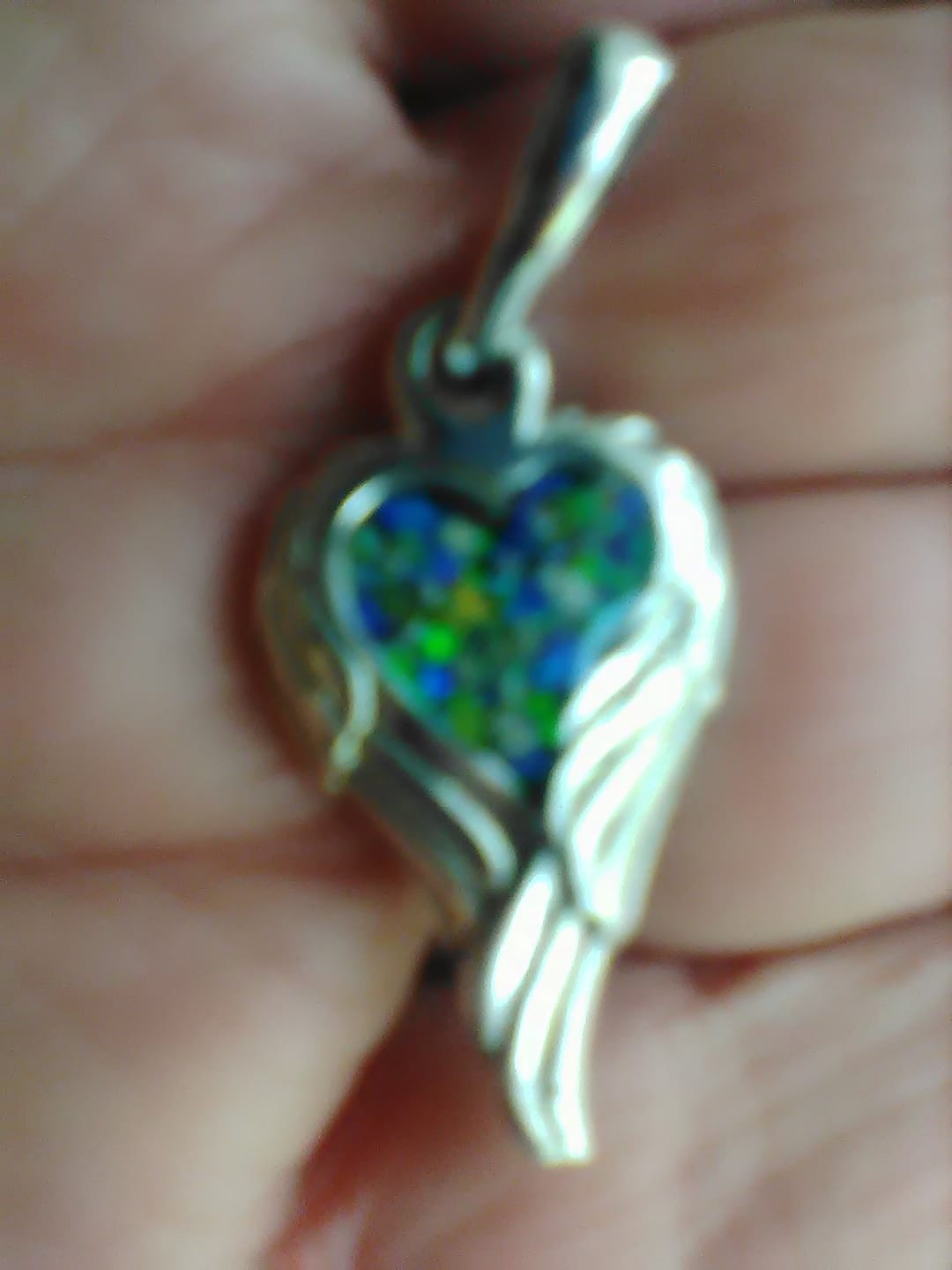 Customer photo review of Petite Angel Wing Pendant - Engravable