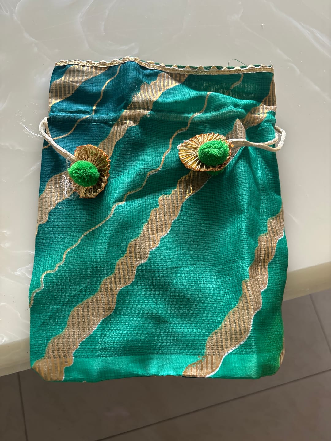 Customer photo review of LAMANSH 8*10 inch Gota Zari work Designer Printed Potli bags for Giveaways 🎁 & Favours / Shagun Pouch Return Gifts for Haldi mehendi roka wedding