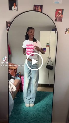 Customer video review of 'Backseat Driver' baby tee