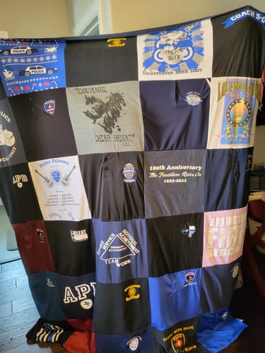 T-shirt quilt with law enforcement, community service themes by Becki from TX