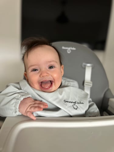 Customer photo review of Gourmet Bubs Waterproof Feeding Smock with Bib Pouch- Off White