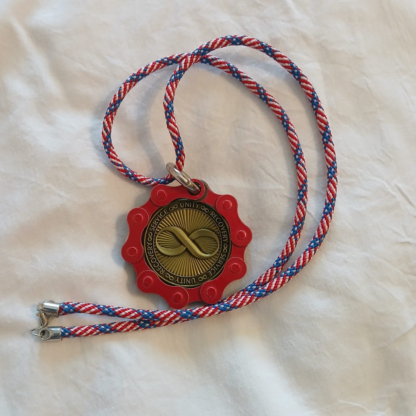 Customer photo review of Infinity Symbol AA/NA Bronze Recovery Medallion