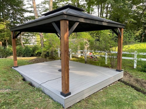 Customer photo review of EROMMY 12'x16' Ultra-Thick Faux Wood Grain Aluminum Frame Hardtop Gazebo, Vertical Stripe Galvanized Steel Double Roof with Netting and Curtains