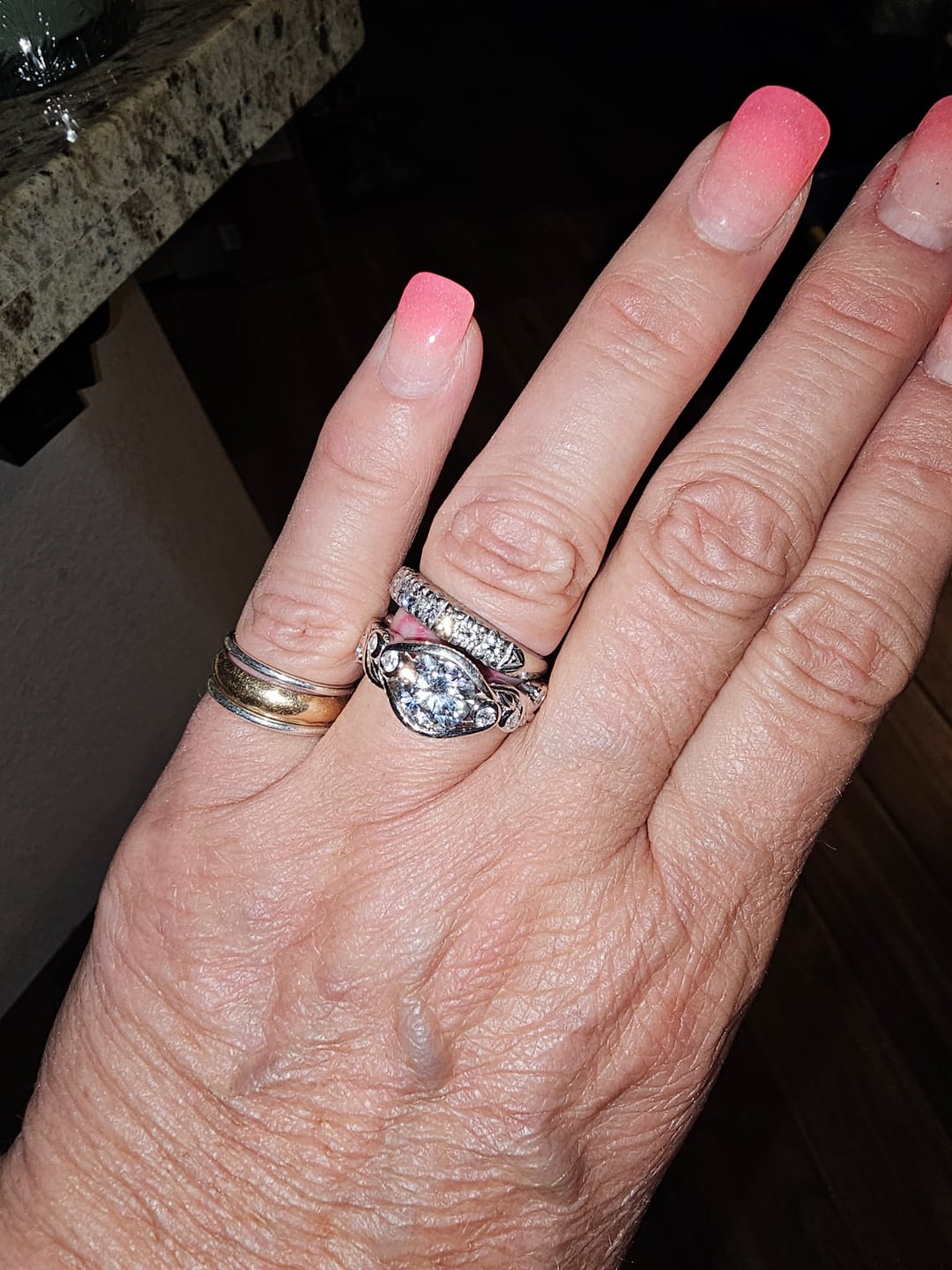Customer photo review of Bezel Set Round Moissanite Scroll Accents Engagement Ring