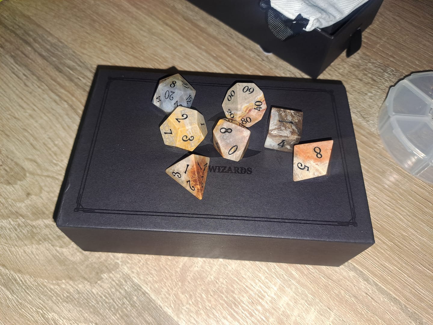 Customer photo review of URWizards D&D Coral Fossil Gemstone Engraved Dice Set