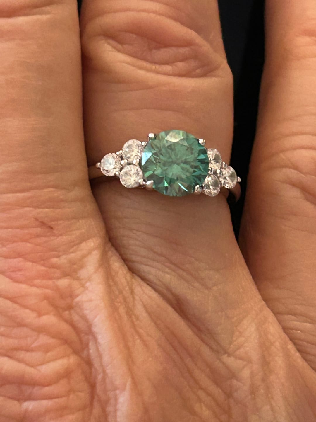 Customer photo review of Green Moissanite Side Stone Engagement Ring