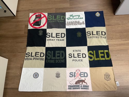 T-shirt quilt with law enforcement, crime investigation themes by Kathy from SC