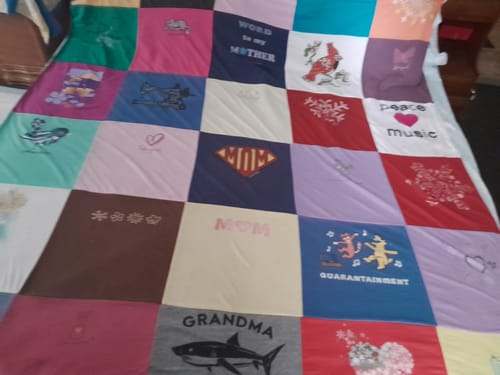 T-shirt quilt with family, music themes by Claire from NH