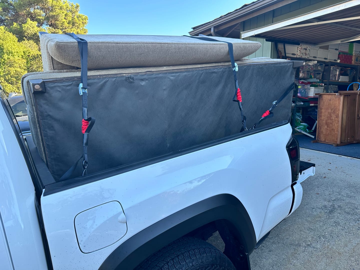 Customer photo review of 14'x1'' Spring Loaded Tie Down Straps - Adapts to Load Shifts - 1500lbs Max Load - Just Pull Alternative to Ratchet Straps with Hooks - For Securing Motorcycles, Kayaks, ATVs