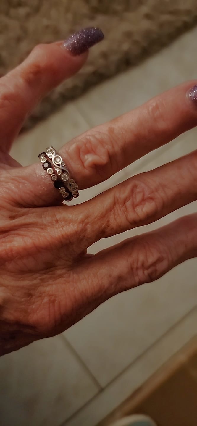 Customer photo review of Bezel Set Round Moissanite Scroll Accents Wedding Band Ring In Sterling Silver