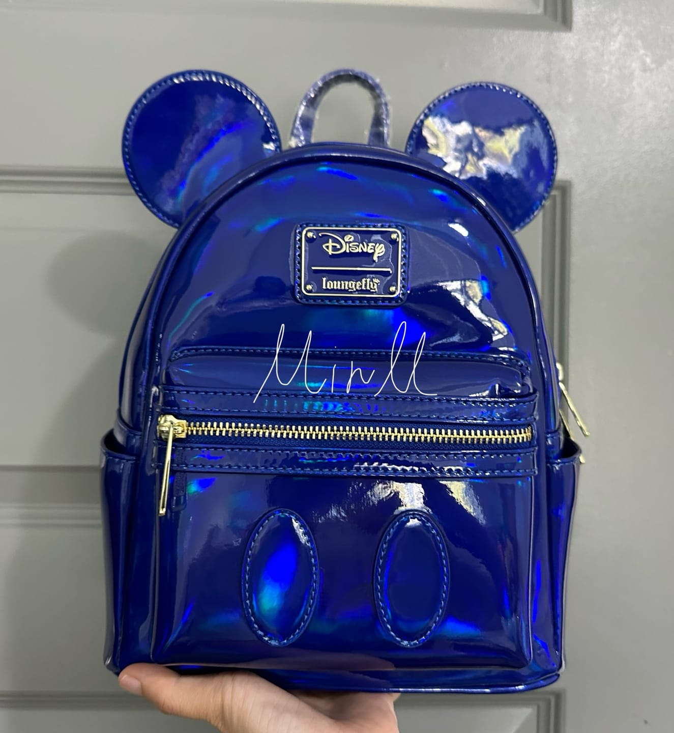 Customer photo review of Loungefly Disney Mickey Mouse Holographic Series Mini Backpack: Sapphire - 707 Street Exclusive
