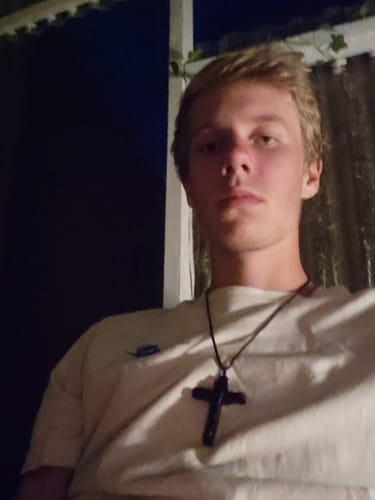 Customer photo review of FREE Today: Jesus Crucifix Wooden Necklace