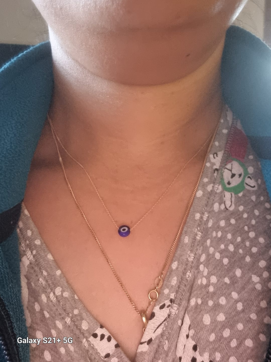 Customer photo review of MYKONOS EVIL EYE BLUE NECKLACE