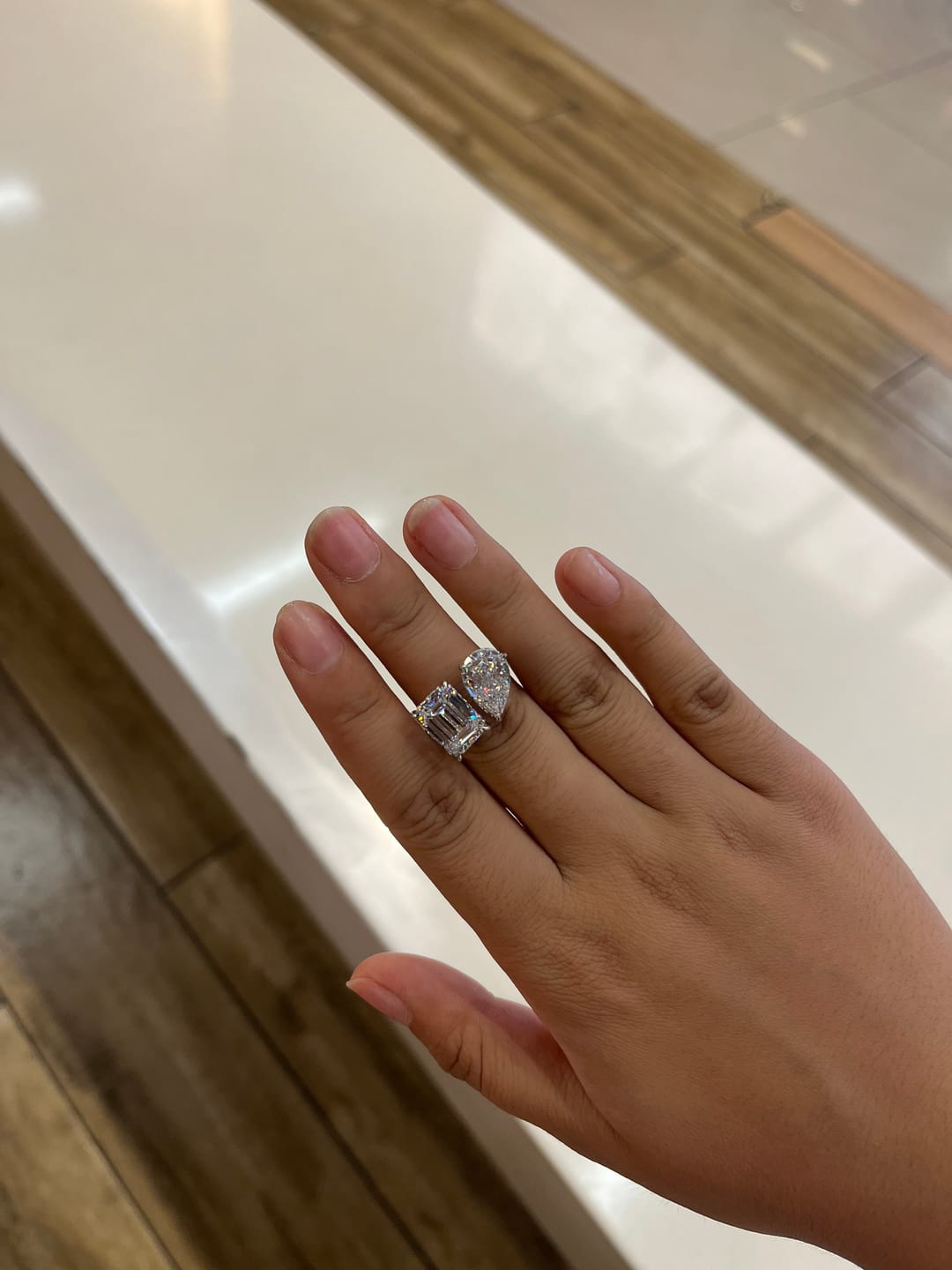 Customer photo review of Louily Unique Double Stones Design Emerald Cut & Pear Cut Engagement Ring