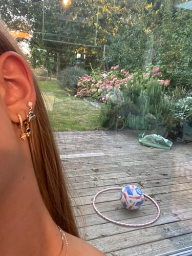 Customer photo review of Cosima Crystal Gold Star Huggie Earrings