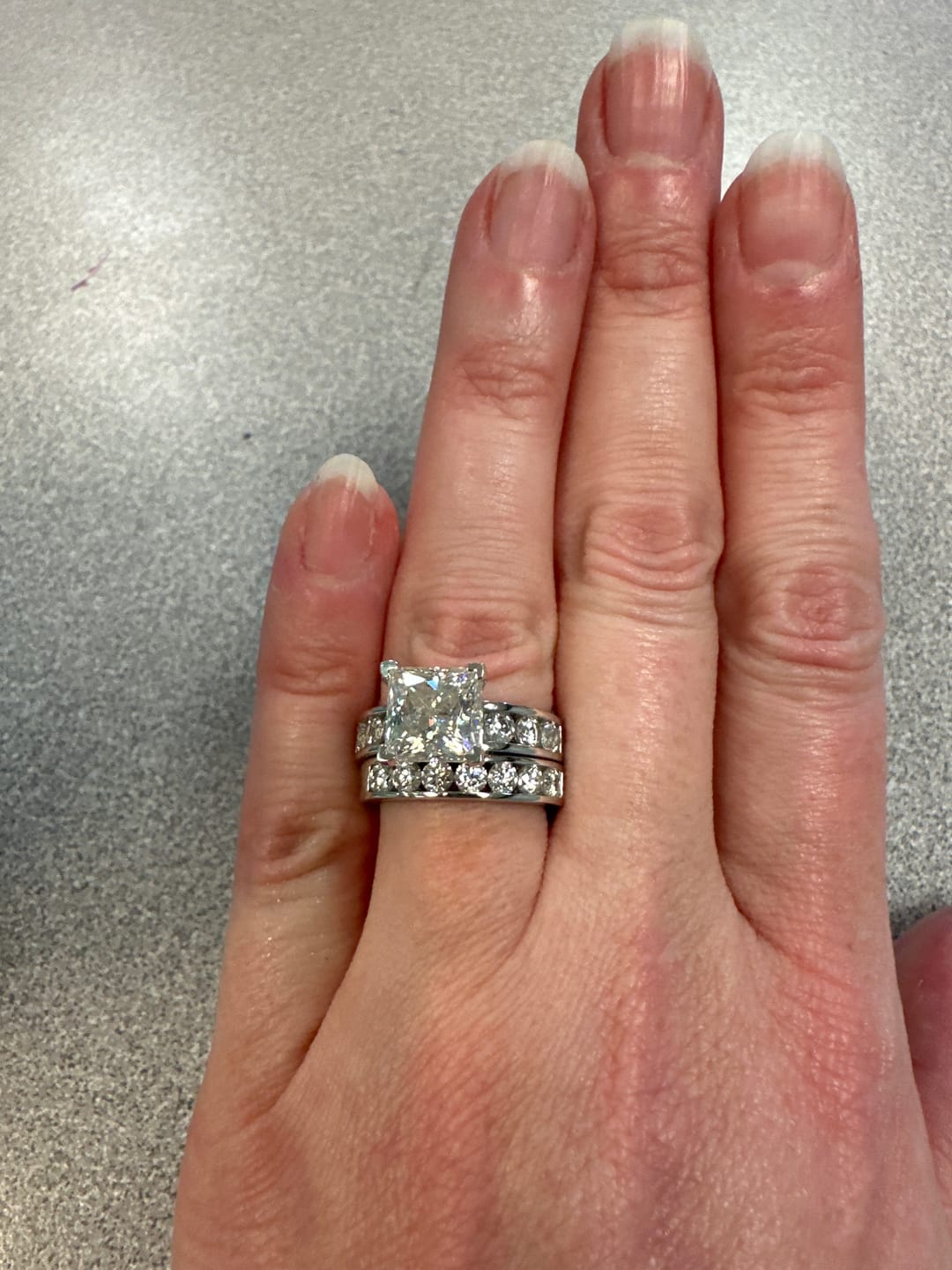 Customer photo review of Princess Cut Moissanite With Round Channel Set Engagement Ring