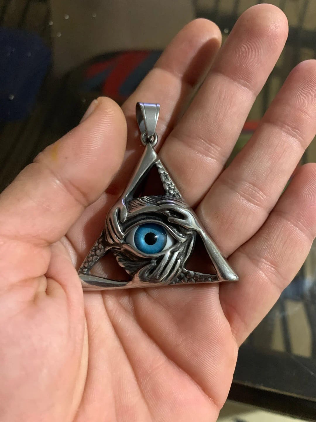 Customer photo review of Evil Eye Pendant Stainless Steel Triangle Necklace