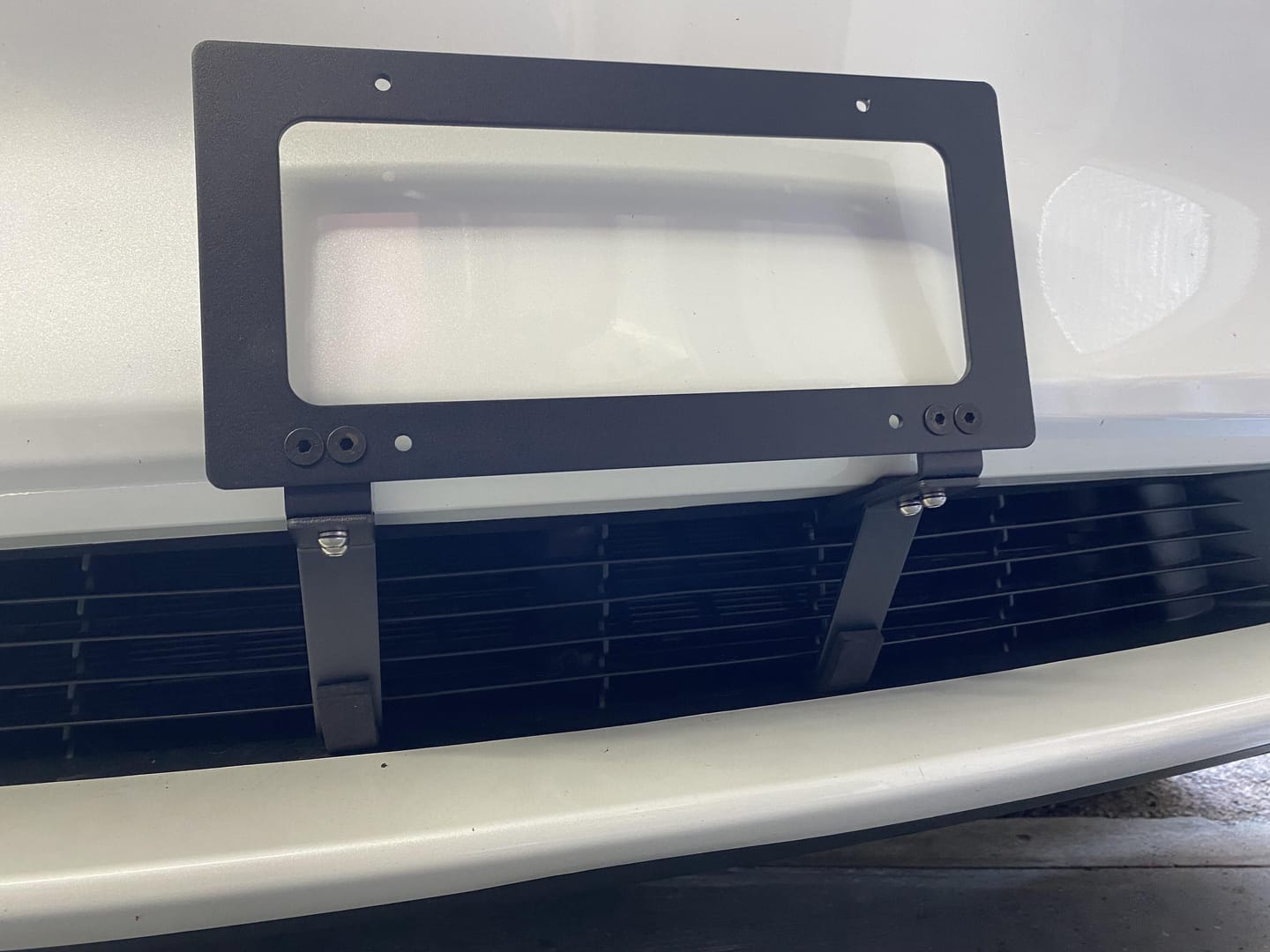 Customer photo review of EVAAM® No Drill Front License Plate Frames Covers for Tesla Model 3/Y (2017-2023)