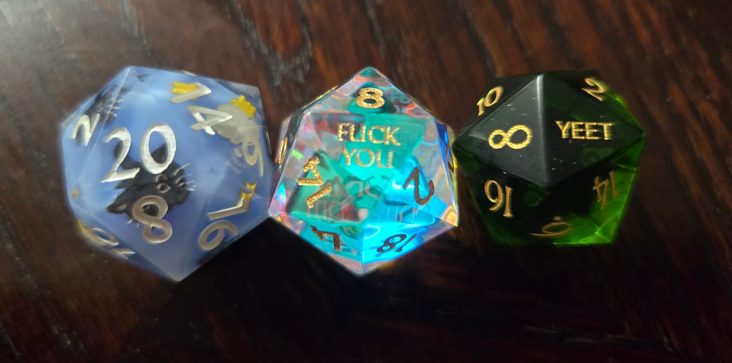 Customer photo review of URWizards D&D Peridot Glass Engraved Dice Set YEET & F*CK