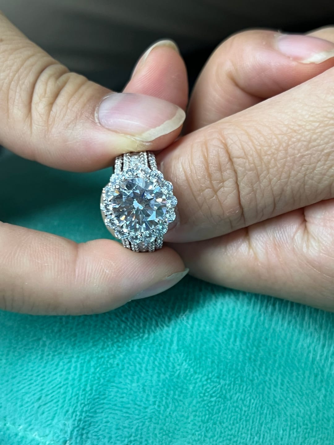 Customer photo review of Louily Unique Halo Design Round Cut Engagement Ring In Sterling Silver
