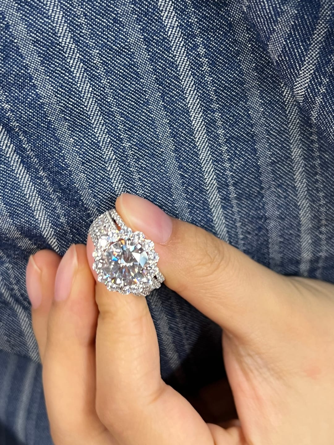 Customer photo review of Louily Unique Halo Design Round Cut Engagement Ring In Sterling Silver