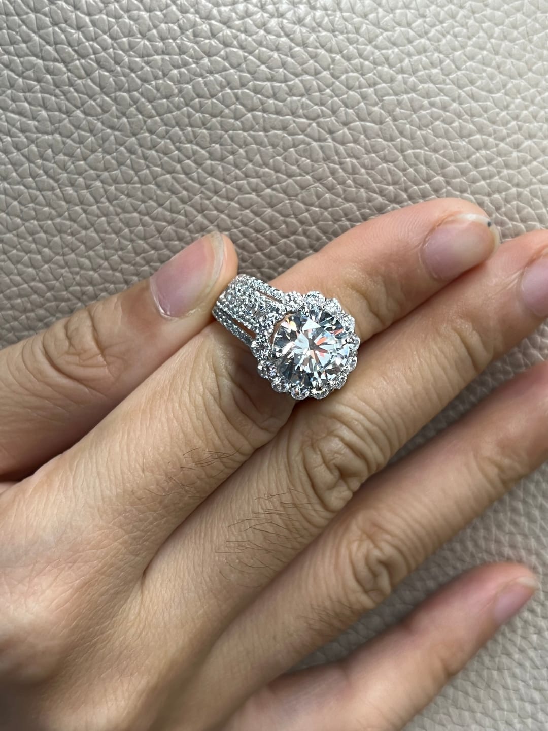Customer photo review of Louily Unique Halo Design Round Cut Engagement Ring In Sterling Silver