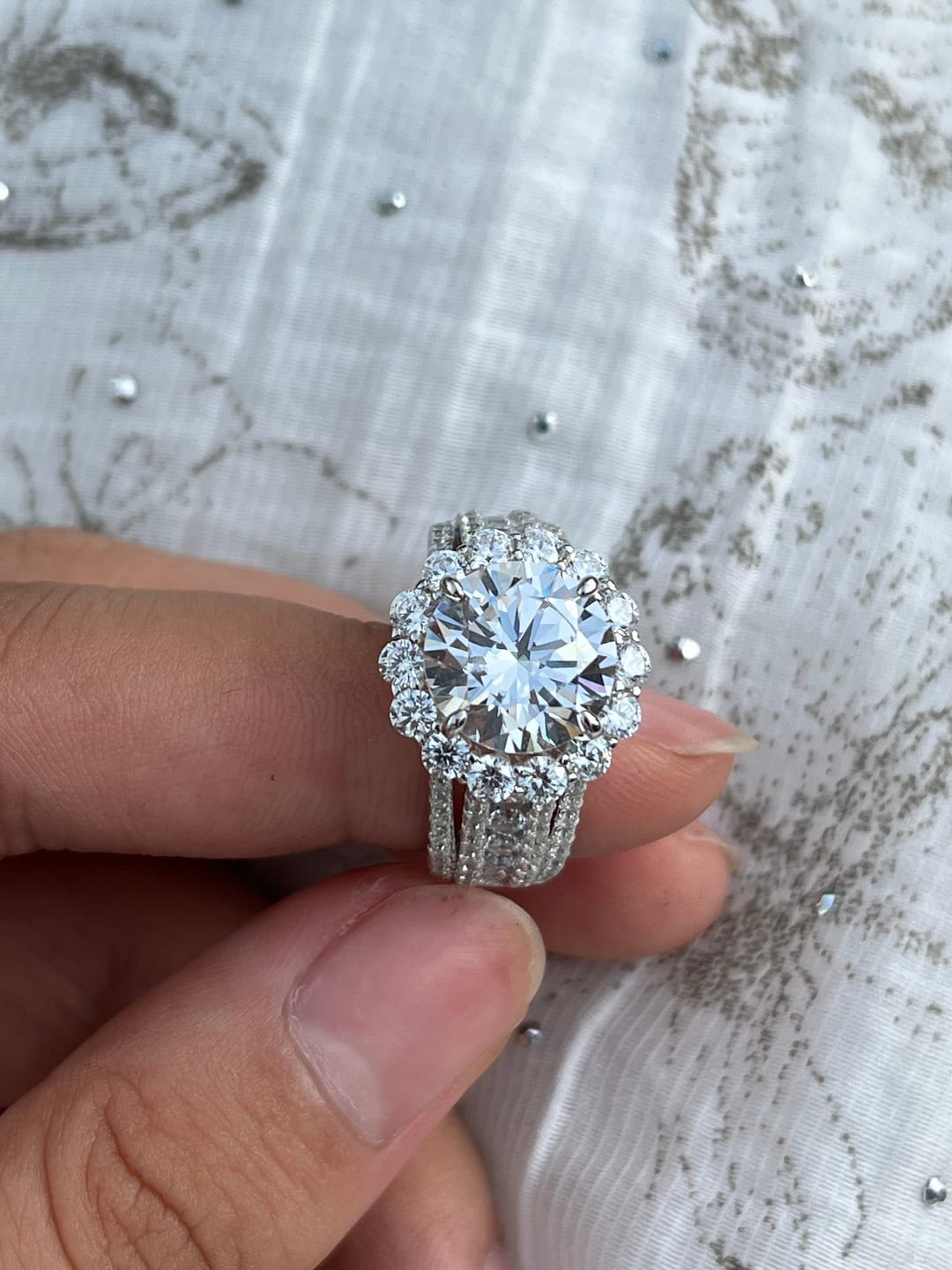 Customer photo review of Louily Unique Halo Design Round Cut Engagement Ring In Sterling Silver