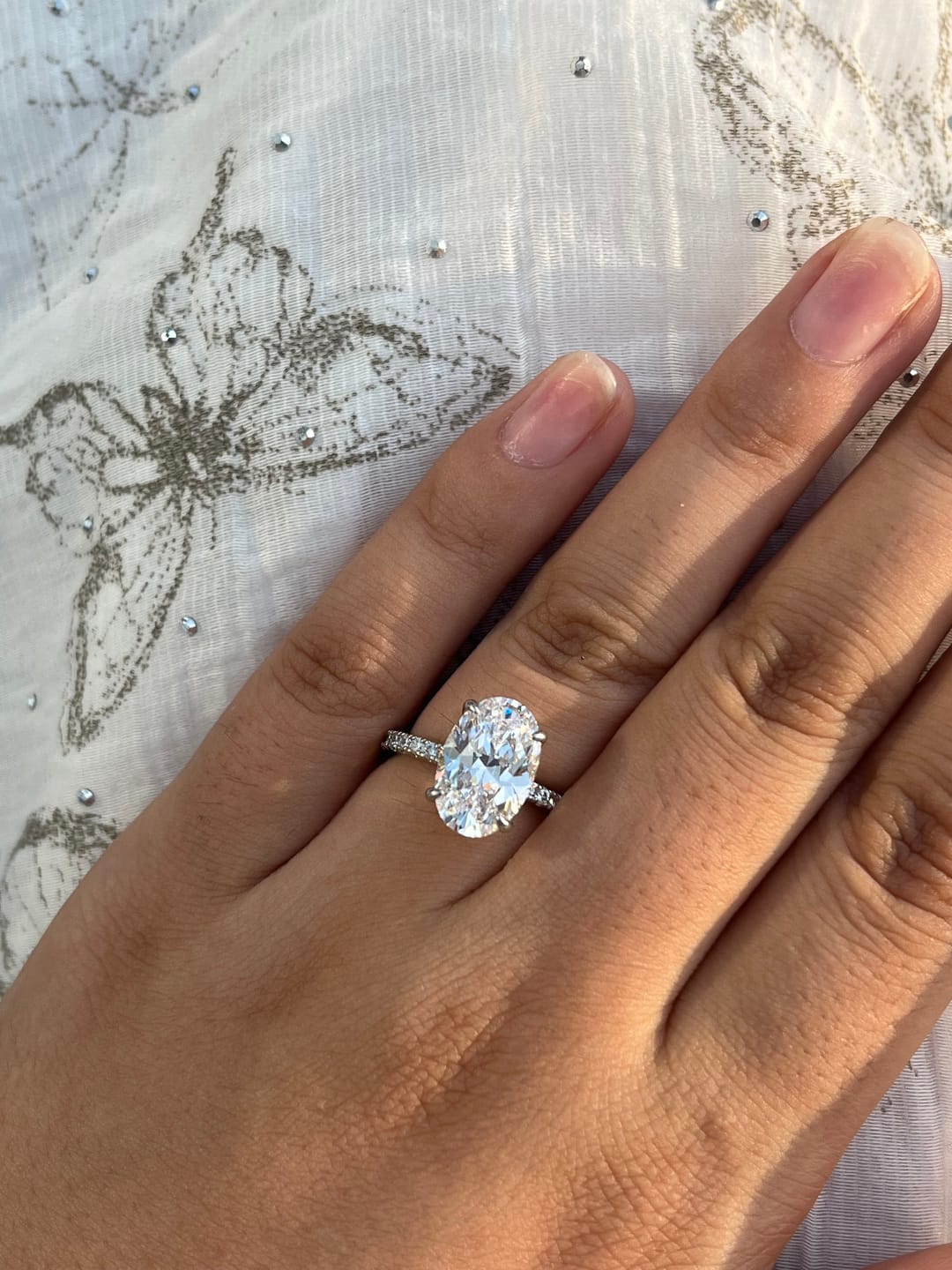 Customer photo review of Louily Halo 3.5Ct Oval Cut Simulated Diamond Engagement Ring In Sterling Silver