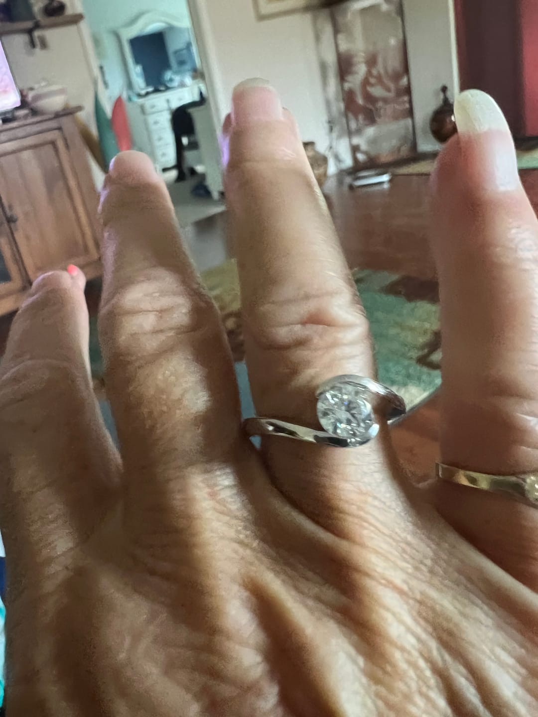 Customer photo review of Solitaire Tension Set Moissanite Bypass Engagement Ring