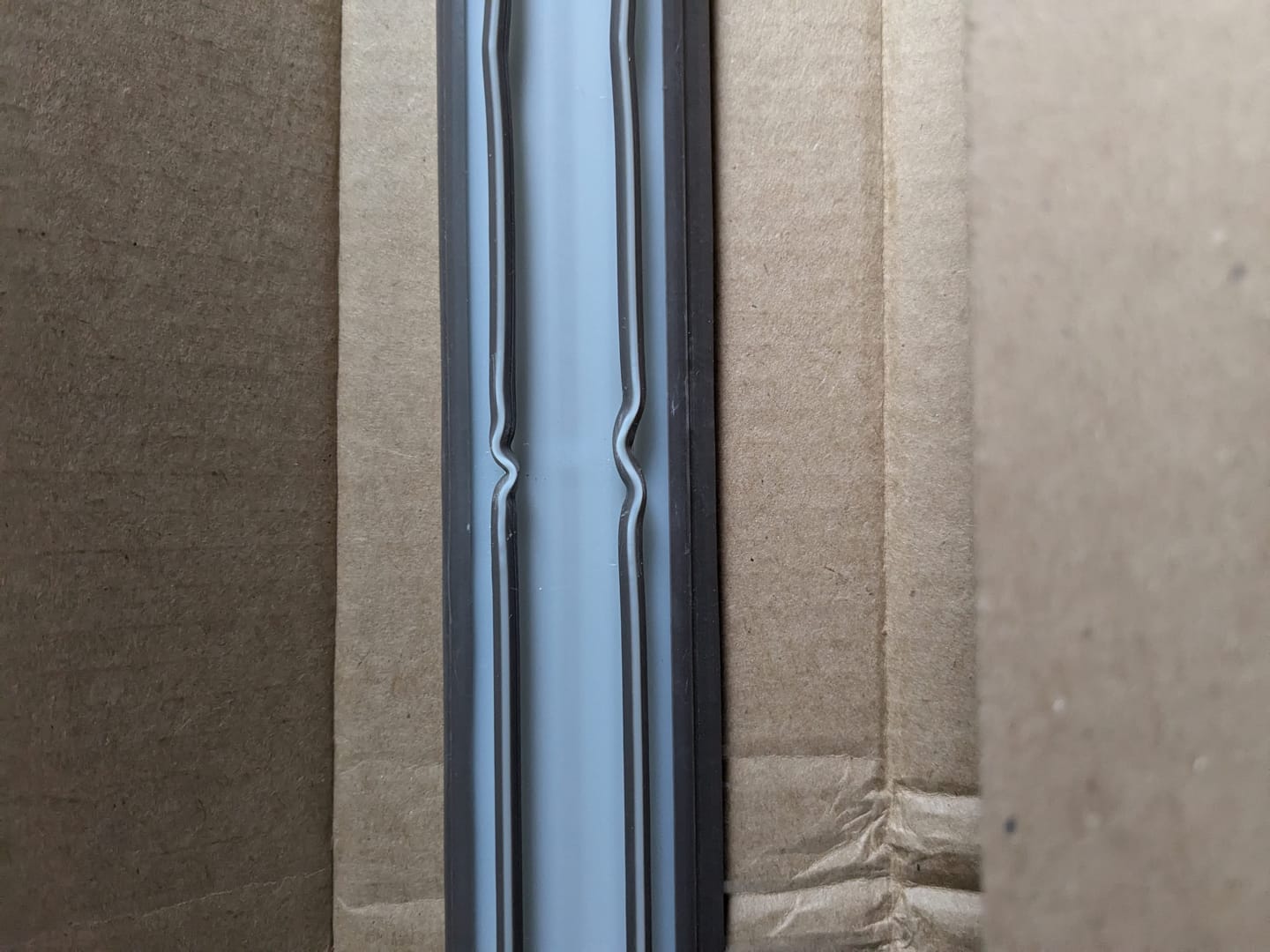 Customer photo review of Universal 7/8" Between Darts Drive-On Door Sweep (dual bulbs)
