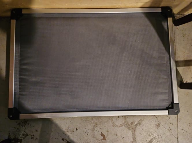 Customer photo review of TitanNest Padded Chew-Proof Elevated Dog Bed for Your Chewer