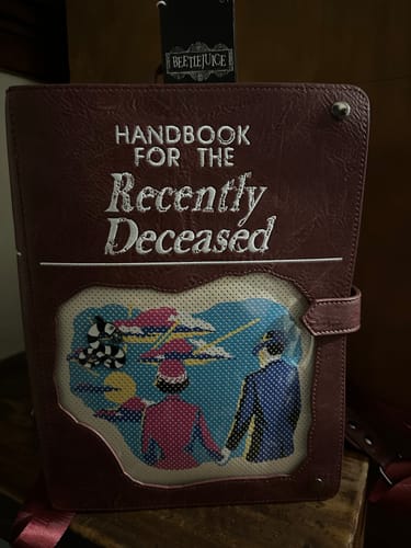 Customer photo review of Loungefly Warner Brothers Beetlejuice Handbook For The Recently Deceased Pin Trader Backpack