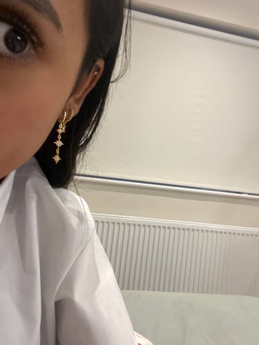 Customer photo review of Romilly Pink Gold Droplet Star Huggie Earrings