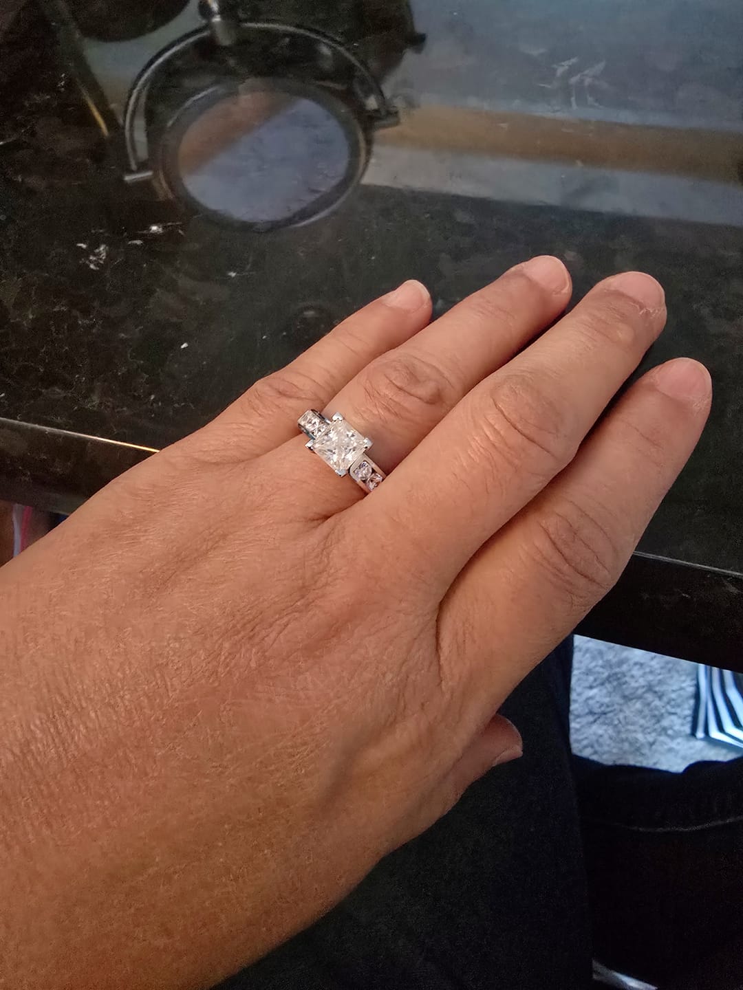 Customer photo review of Princess Cut Moissanite With Round Channel Set Engagement Ring