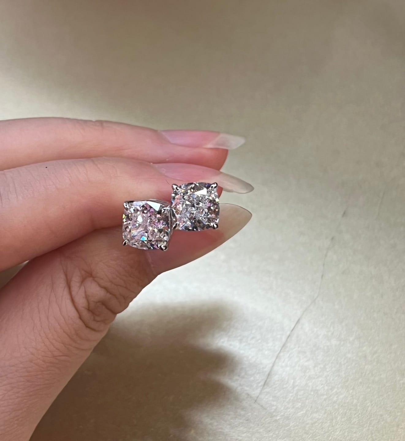 Customer photo review of Louily 1.5 CT Cushion Cut Sterling Silver Women's Stud Earrings