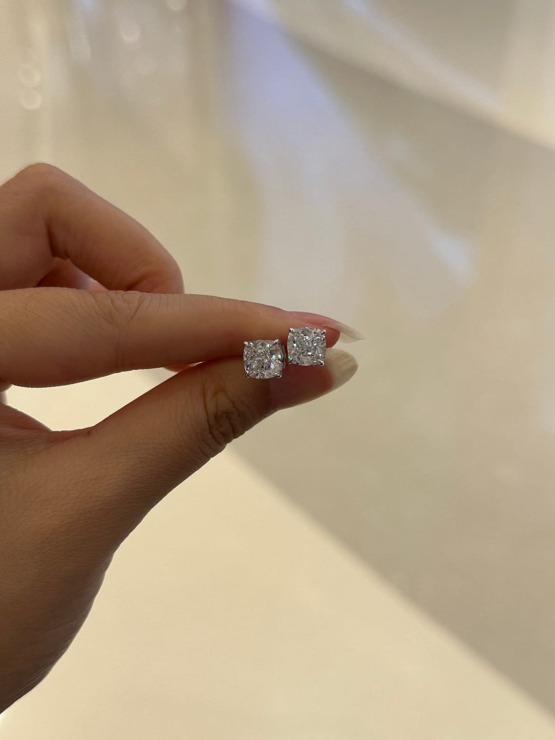 Customer photo review of Louily 1.5 CT Cushion Cut Sterling Silver Women's Stud Earrings