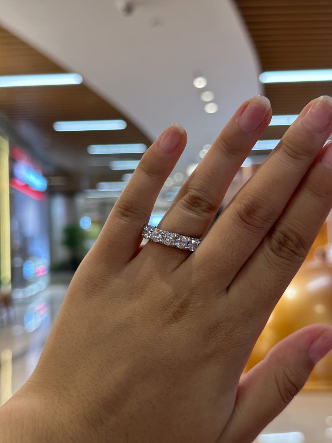Customer photo review of Louily 5 Ct Luxury Eternity Round Cut Wedding Band In Sterling Silver