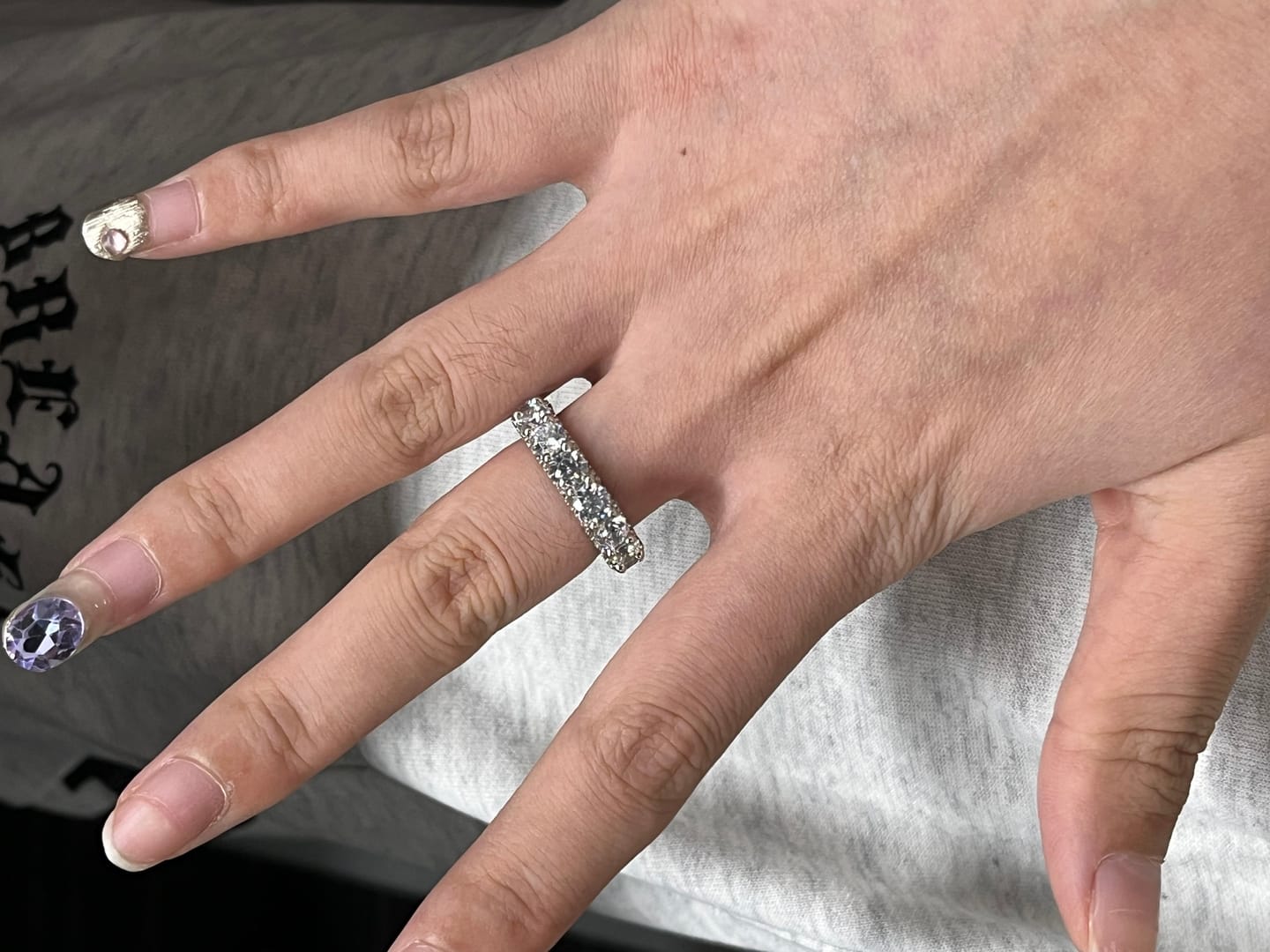 Customer photo review of Louily 5 Ct Luxury Eternity Round Cut Wedding Band In Sterling Silver