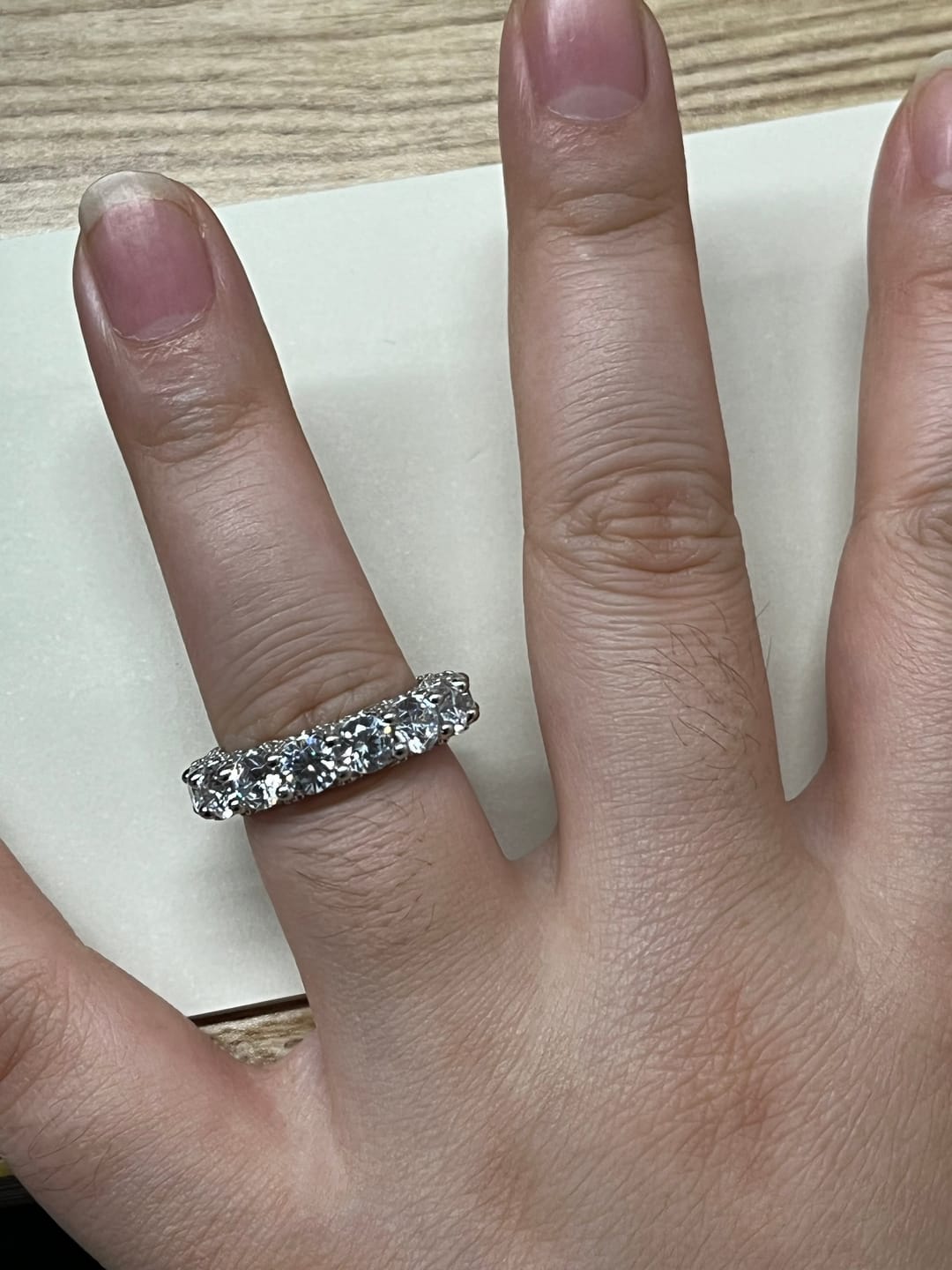 Customer photo review of Louily 5 Ct Luxury Eternity Round Cut Wedding Band In Sterling Silver