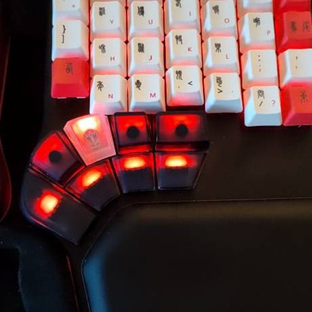 Customer photo review of Dygma Defy thumb cluster keycap set