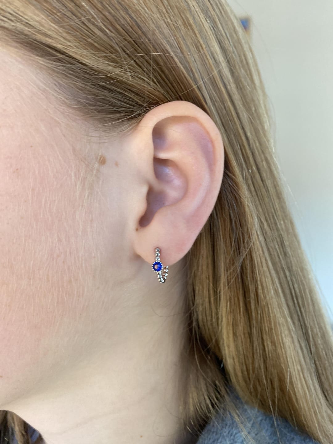 Customer photo review of Nadine Blue Silver Dainty Gem Huggie Earrings