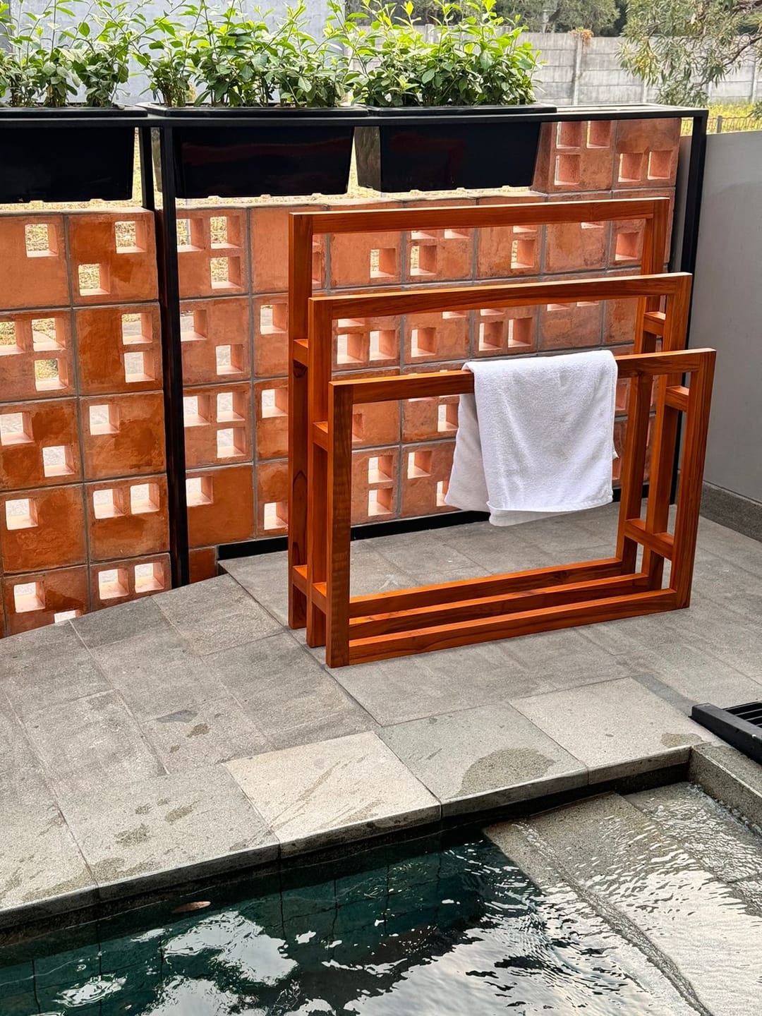 Customer photo review of Exclusive Tiered Teak Towel Rack