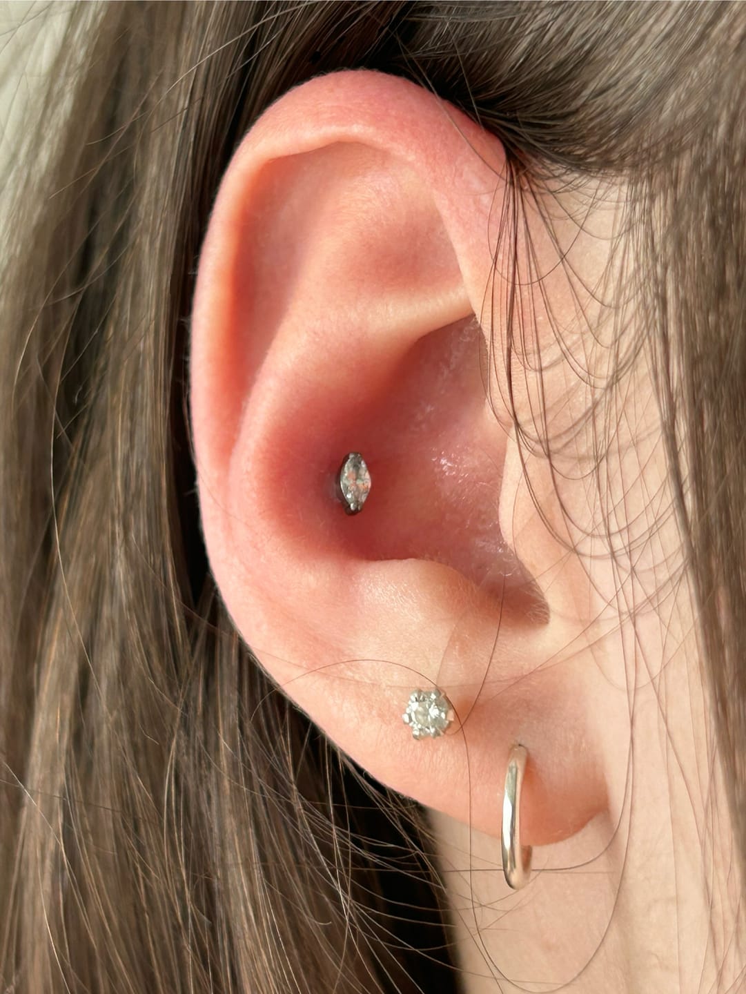 Customer photo review of Single Stone Piercing | Titan
