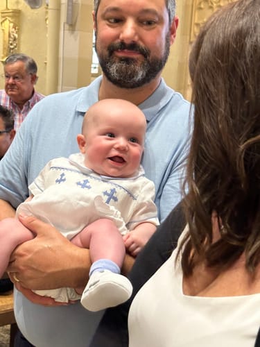 Customer photo review of Smocked Blue Cross White Boy Bubble