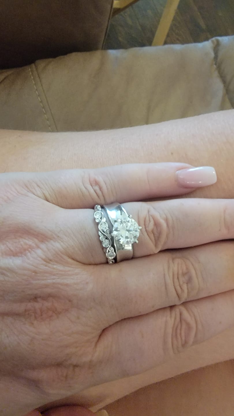 Customer photo review of Bezel Set Round Moissanite Scroll Accents Wedding Band Ring In Sterling Silver